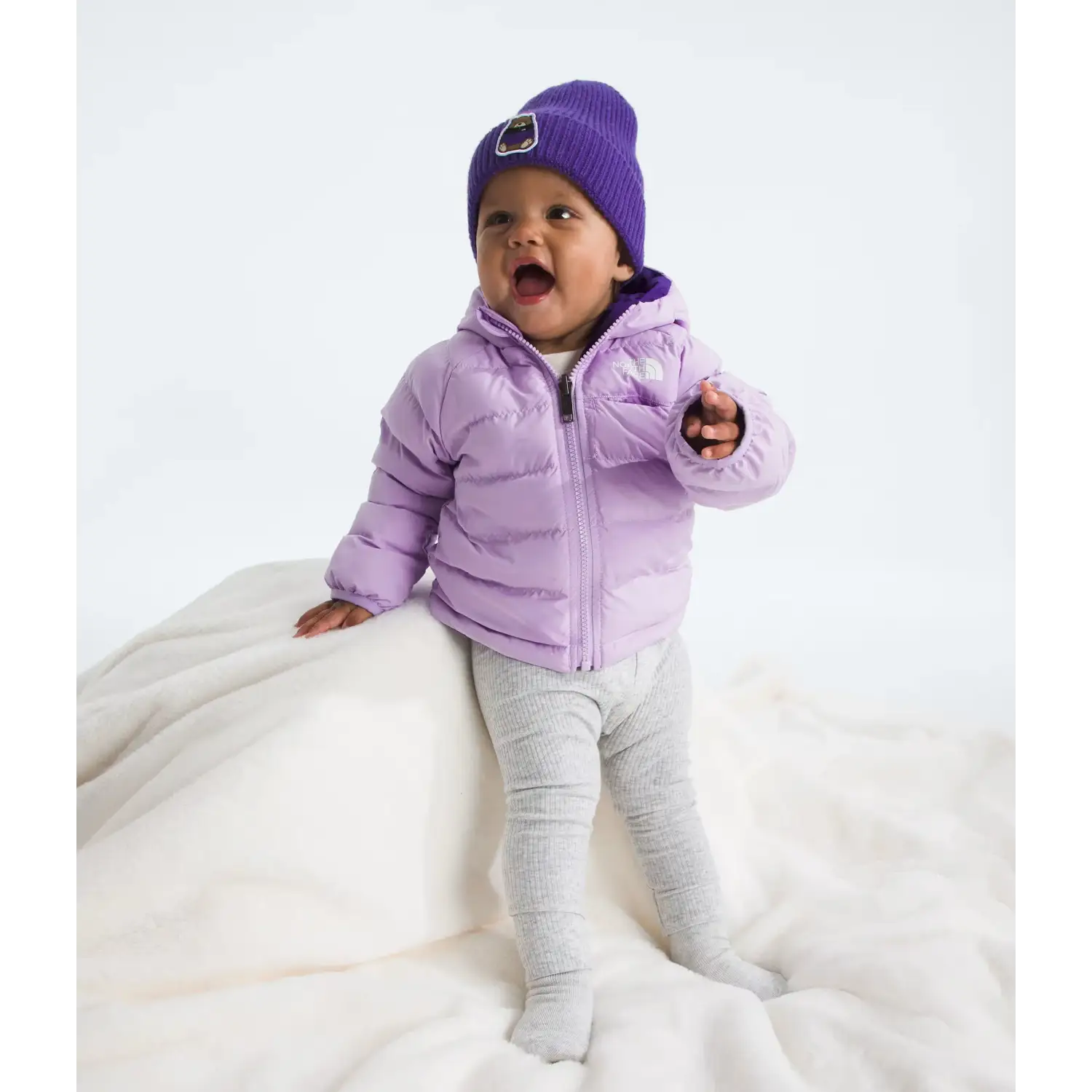 The North Face Baby Reversible Perrito Hooded Jacket in Lite Lilac, front view on model 