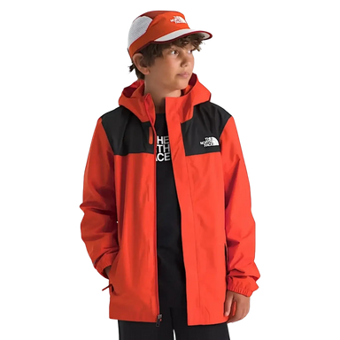 The North Face Boys' Antora Rain Jacket in lava red, on model front view