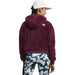 The North Face Girl's Suave Oso Hooded Full-Zip Jacket shown in Boysenberry color option on model. Back view.