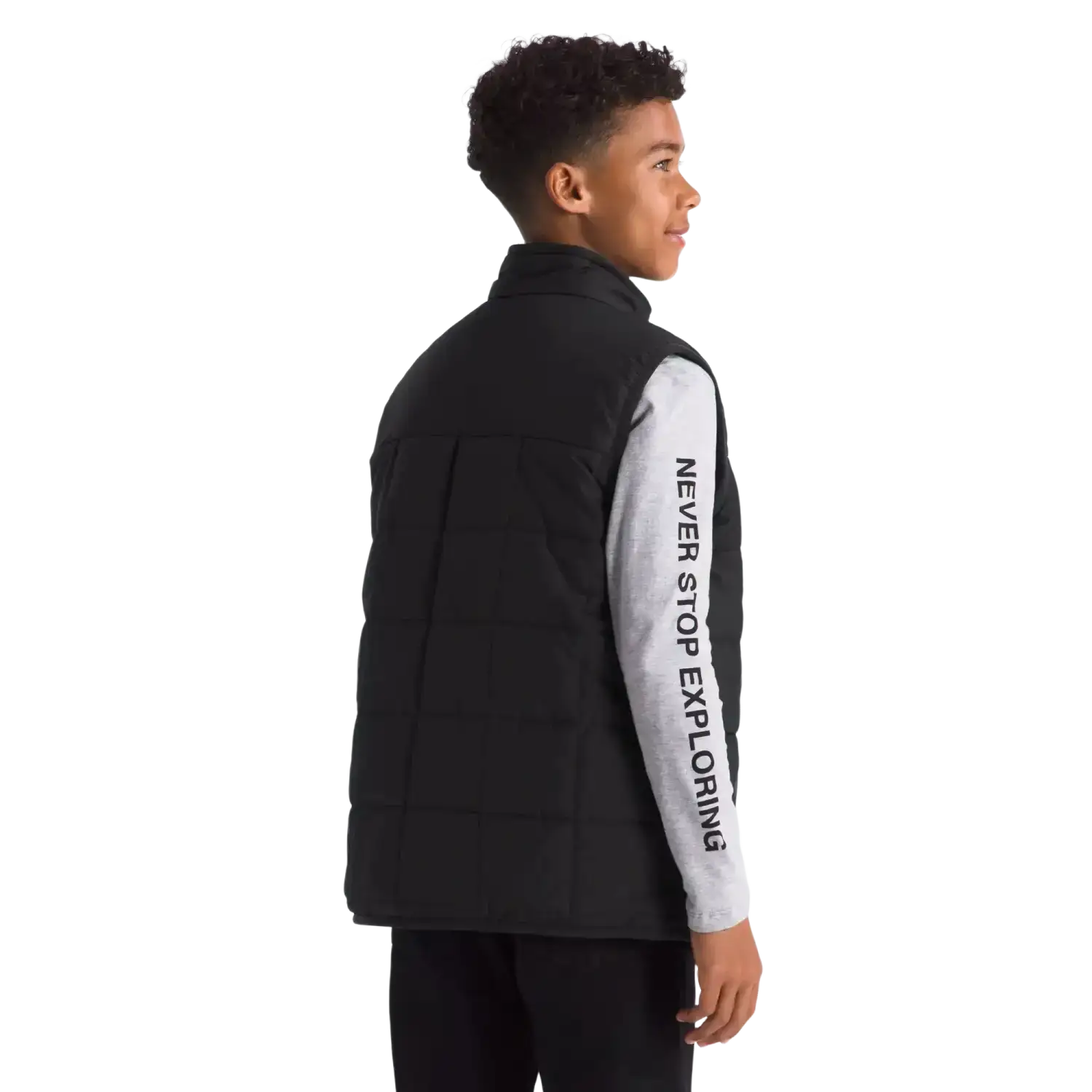 The North Face Kid's Reversible Shasta Vest in TNF Black, back view on model 