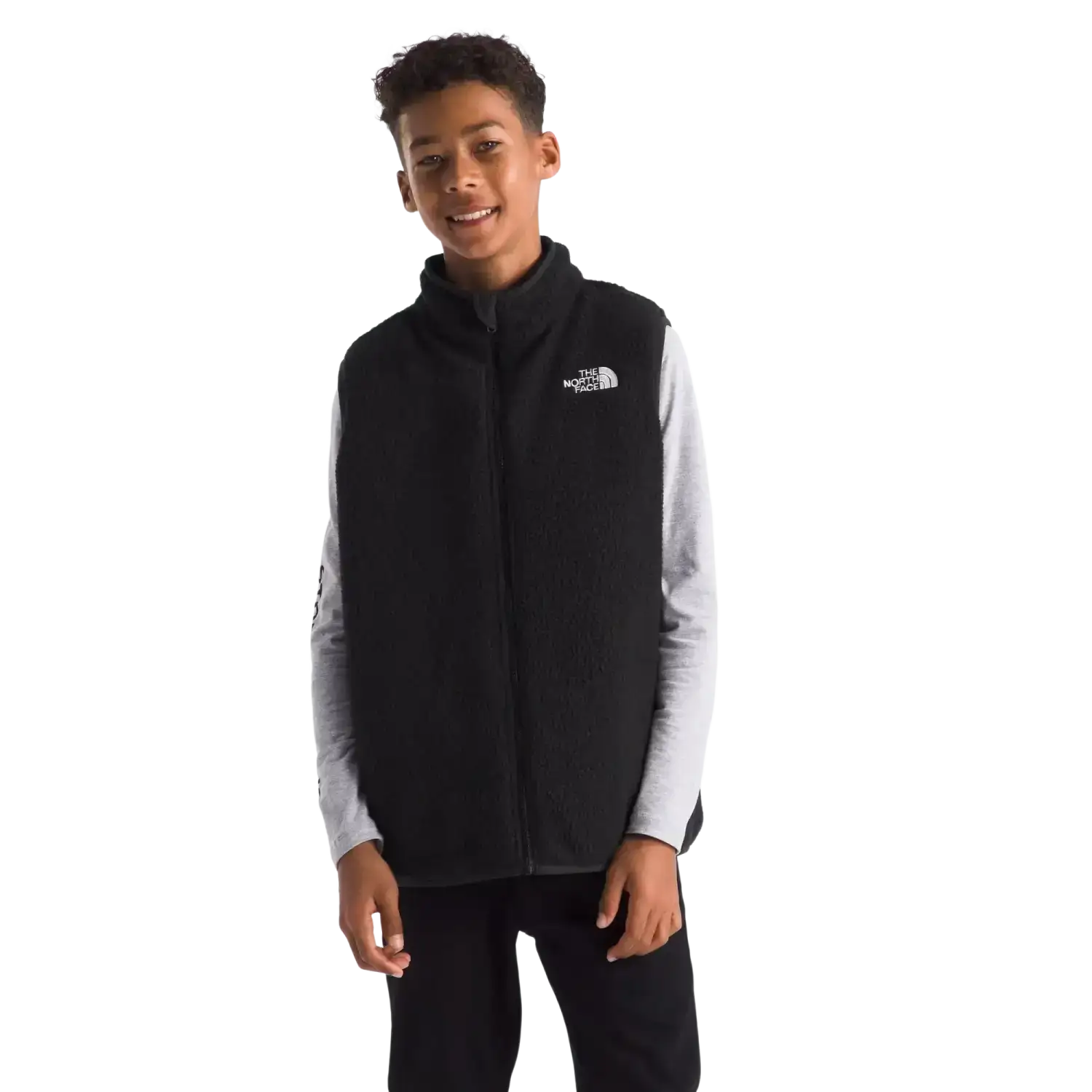 The North Face Kid's Reversible Shasta Vest in TNF Black, front view on model 