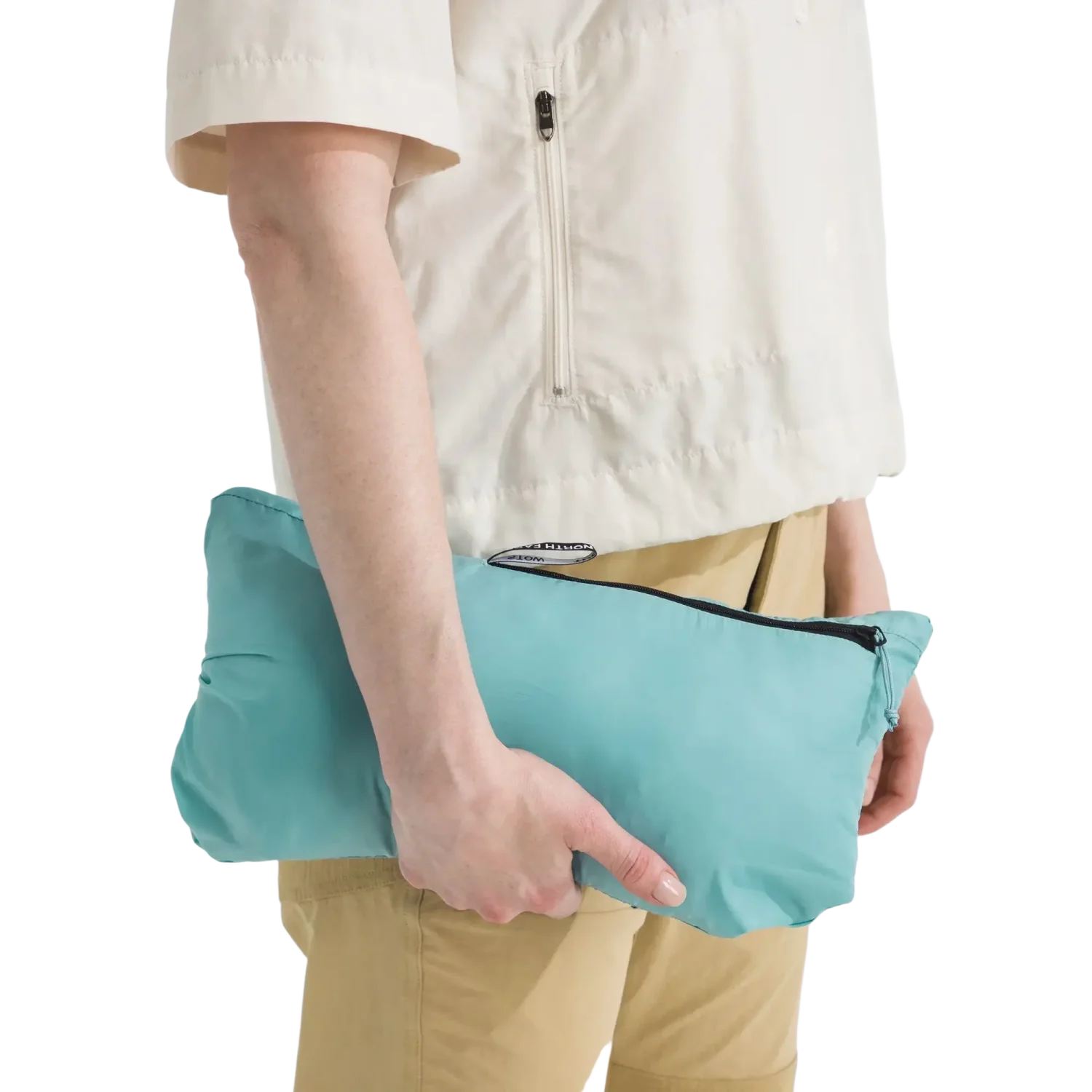 The North Face Women's Terra Peak Hoodie in Space, view of jacket packed up with model holding it