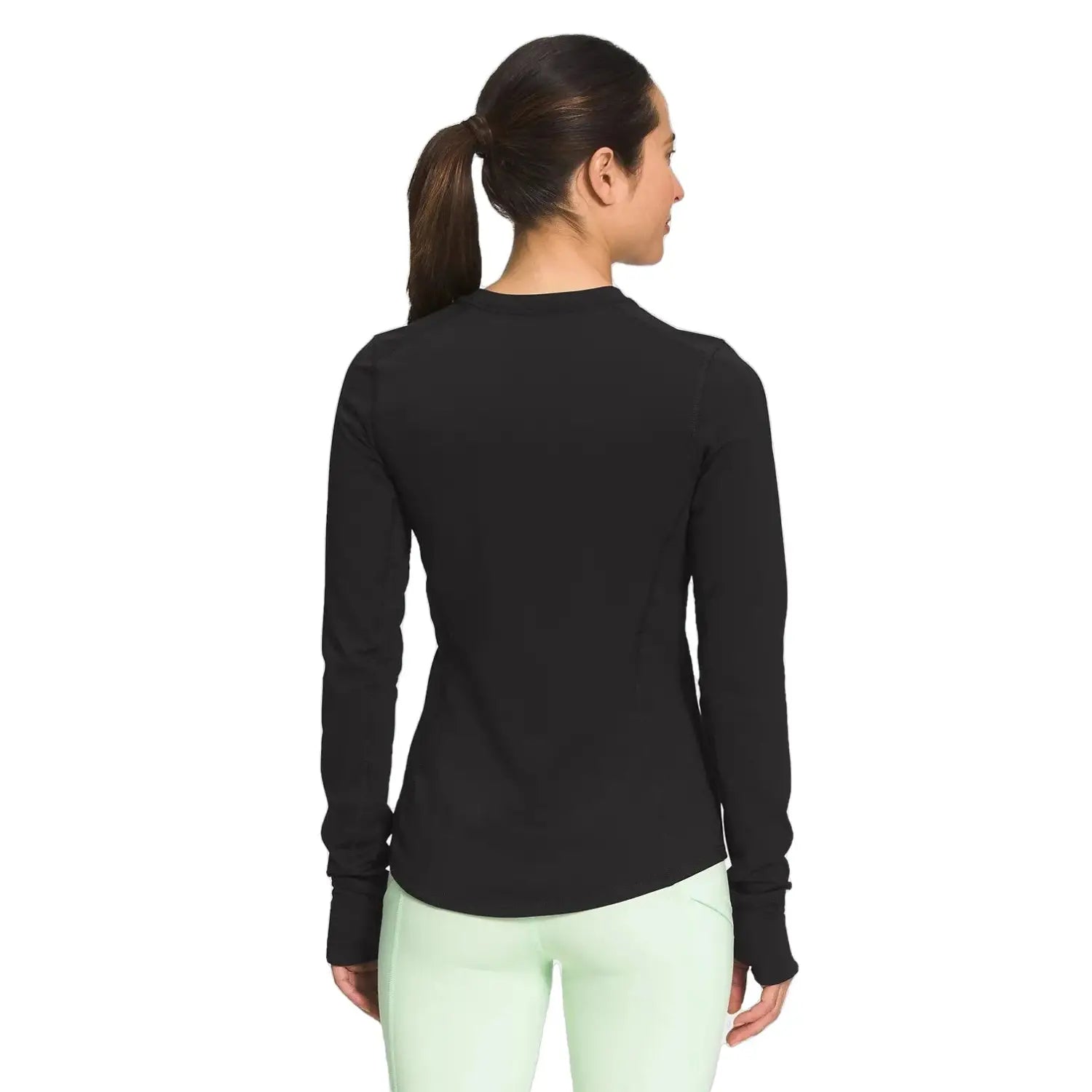 The North Face Women's Winter Warm Essential Crew shown in black on model. Back view.