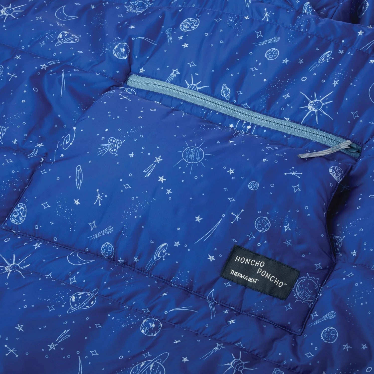 Therm-a-Rest Kid's Honcho Poncho™ shown in the Blue Space Print. Pocket view.