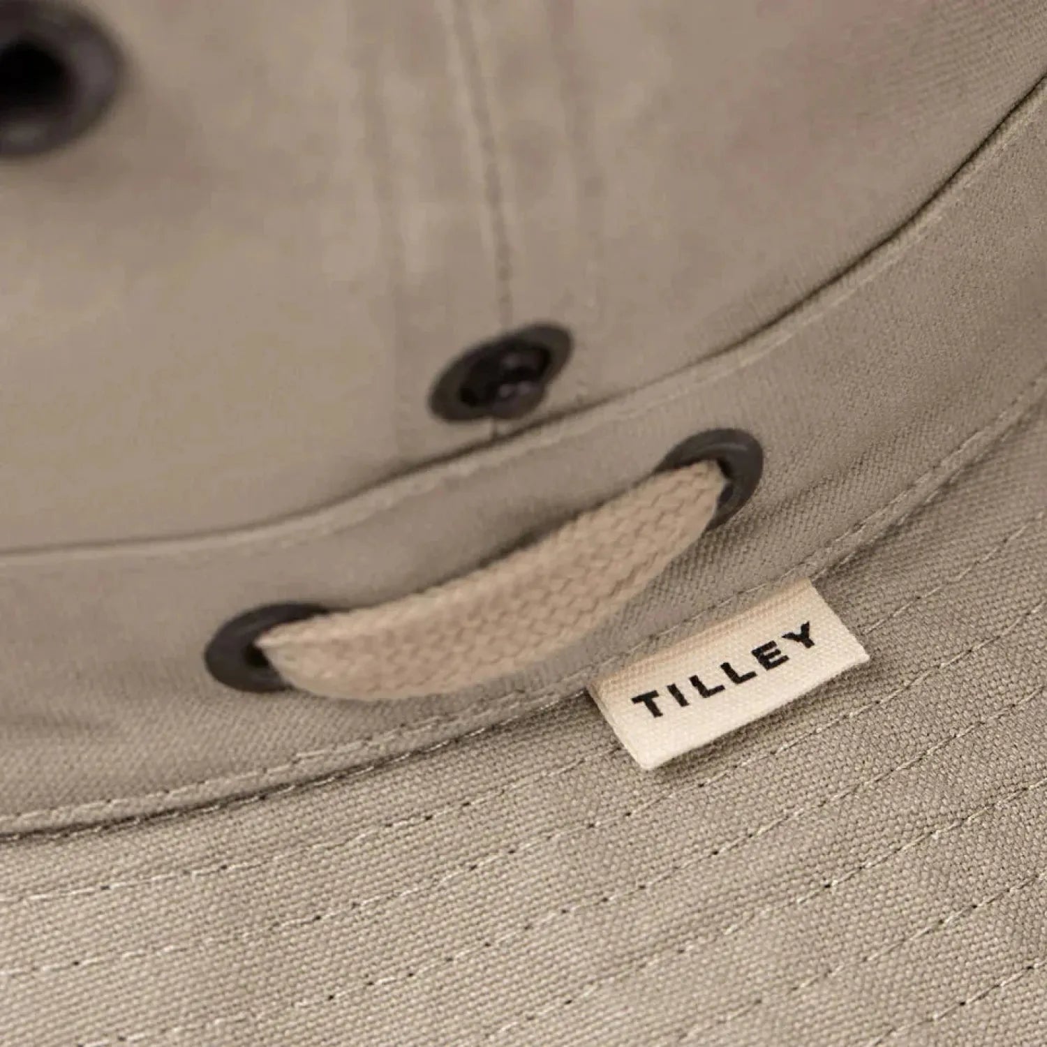 Tilley's T3 Wanderer Hat shown in Khaki color. Cream tag with black lettering.