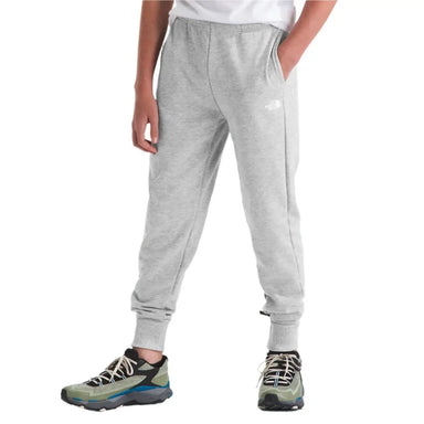 The North Face K's Camp Fleece Joggers, TNF Light Grey Heather, front view on model 