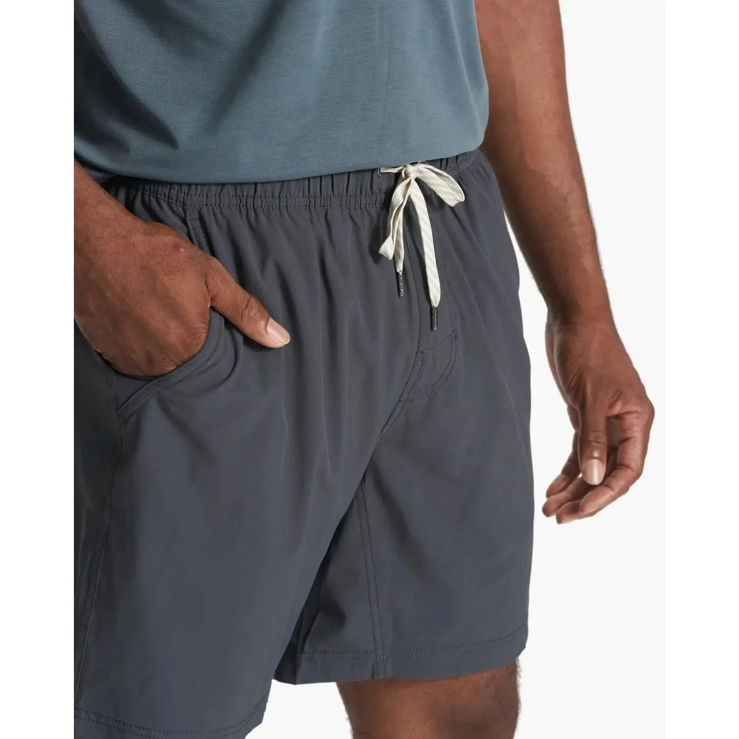 Vuori Men's Kore Short shown in Charcoal on model - front view with white string ties.