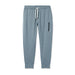 Vuori Men's Sunday Performance Jogger shown in the Dusty Blue Heather color option. Front view.