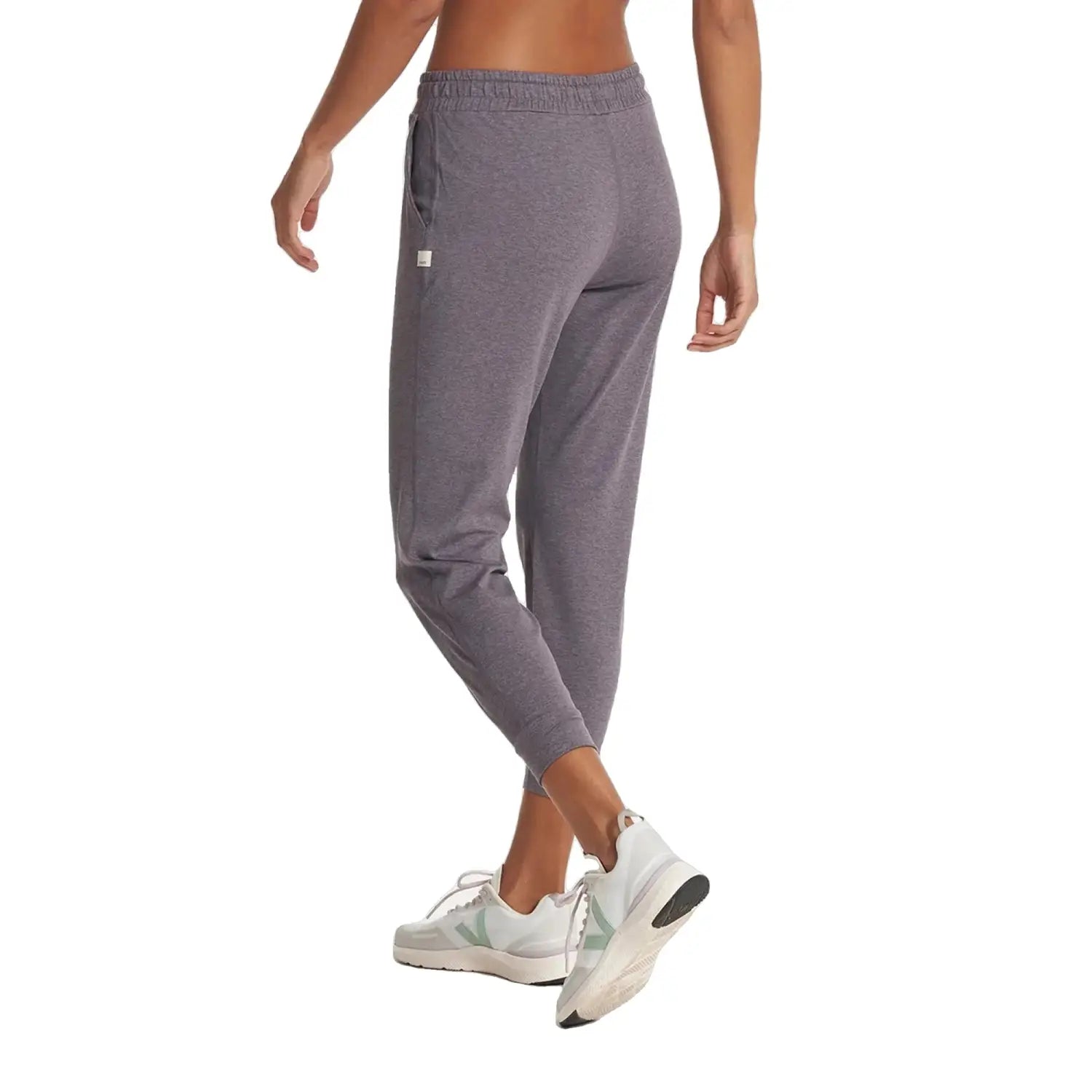 Vuori Women's Performance Jogger shown on model in Sawyer Heather, a purple heathered color. Back View.