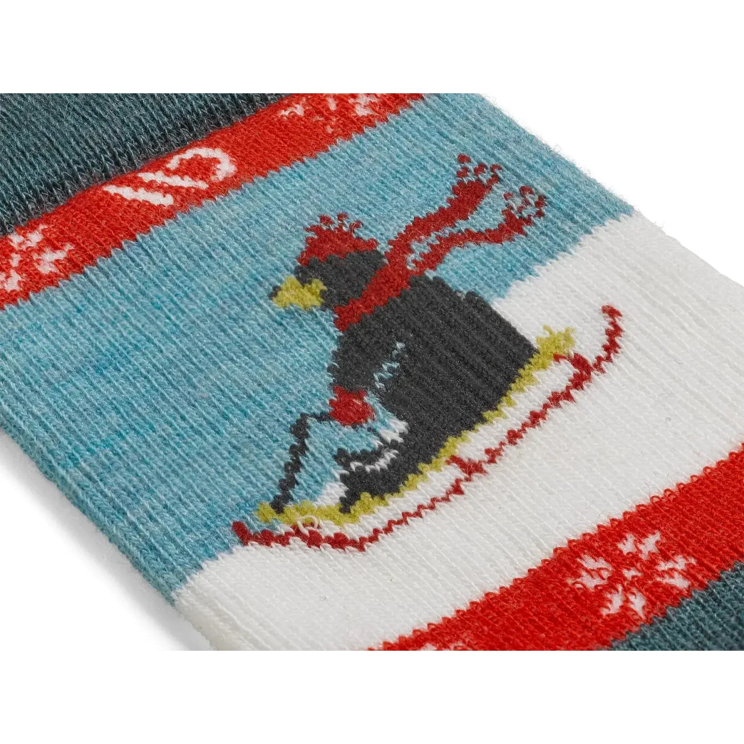 Knitted sock with bear design on a blue background