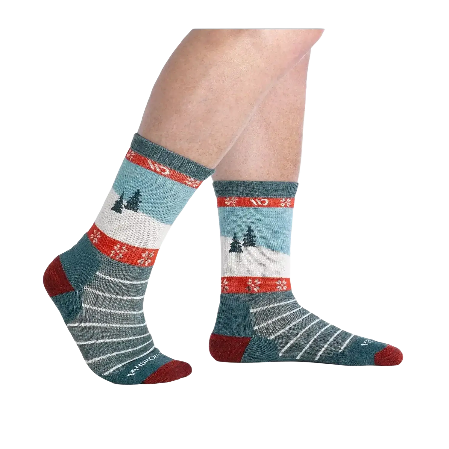 Pair of socks with a winter scene design on a white background