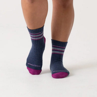 WIDE OPEN® Women’s Multi Stripe Cushioned Micro Crew Socks shown in the Denim color option. Show on model, front view.