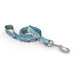 Wingo Outdoors Dog Leash in Alpine Snow design, snowy mountain and tree scape of aqua, blue, white, and greys. 