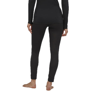 Patagonia Women's Capilene® Thermal Weight Bottoms in black. Back view on model