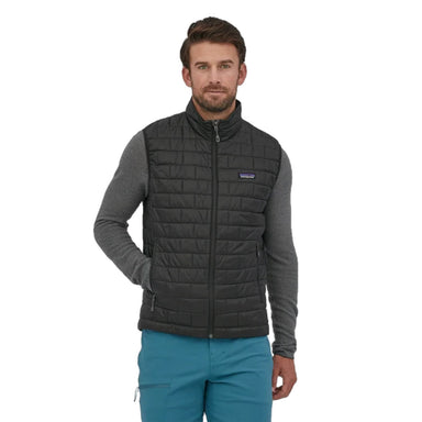 Patagonia Men's Nano Puff® Vest shown in Black. Front view on model with Patagonia logo.