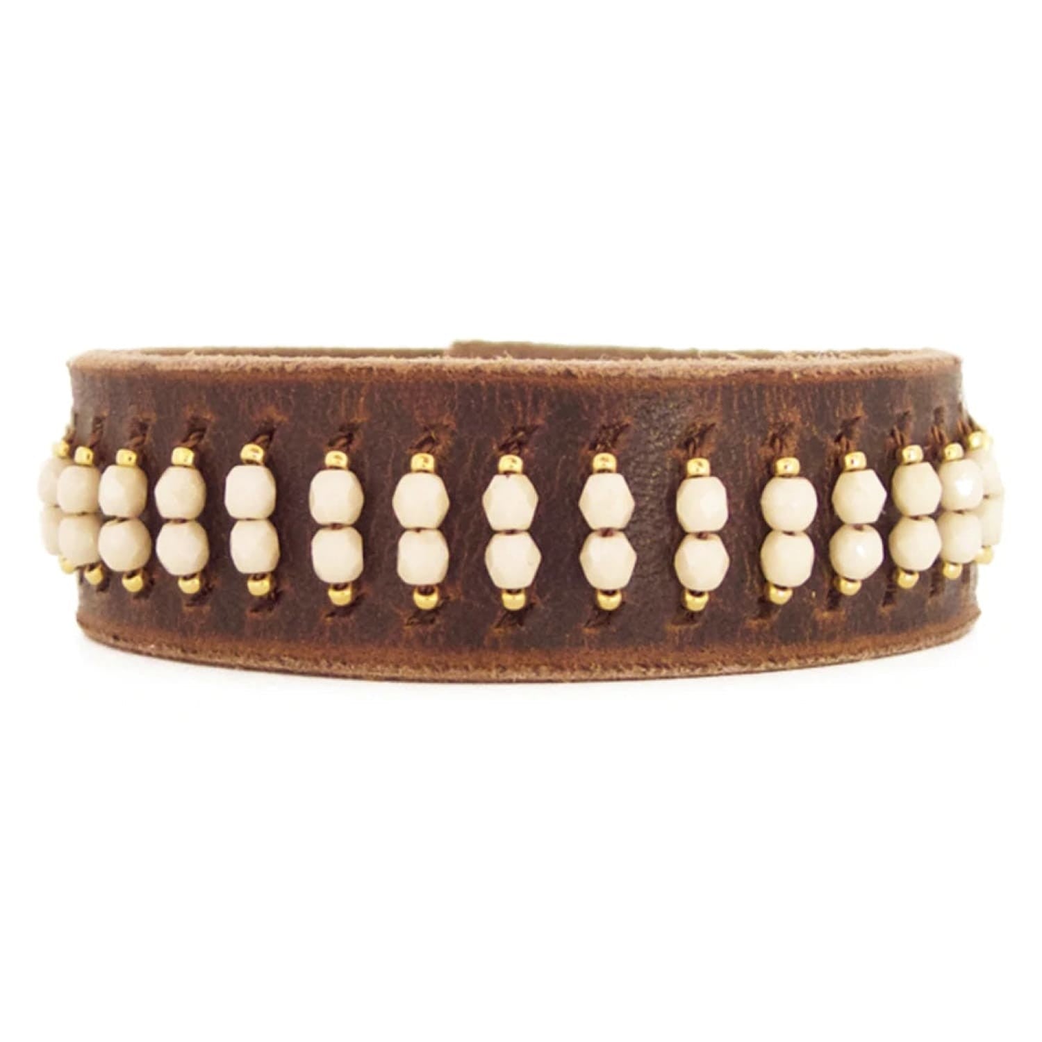 Bronwen brown leather cuff braclet with rows of champagne beads flanked by smaller gold beads.